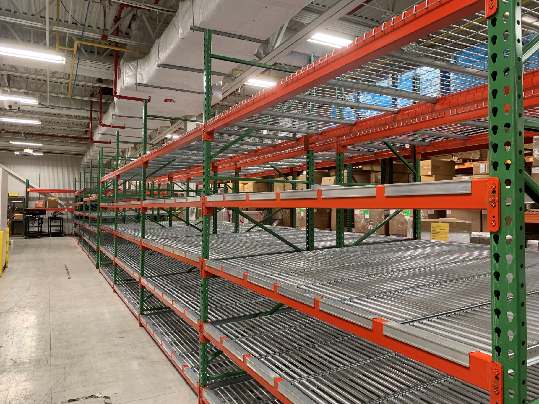 Carton flow racking with roller lanes